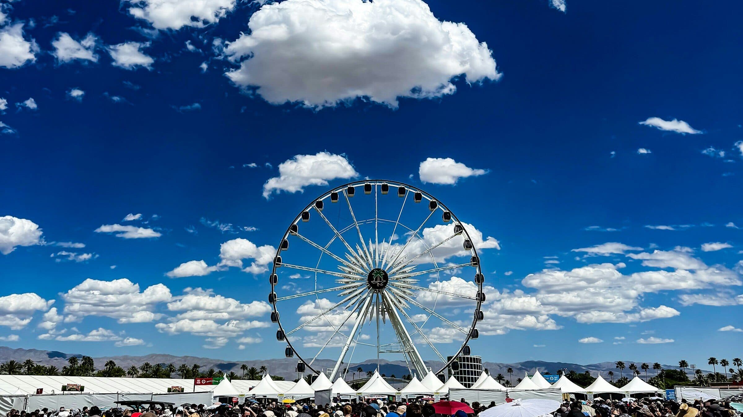 Crowd gathered in front of the Coachella main stage and Ferris wheel, April 2026.